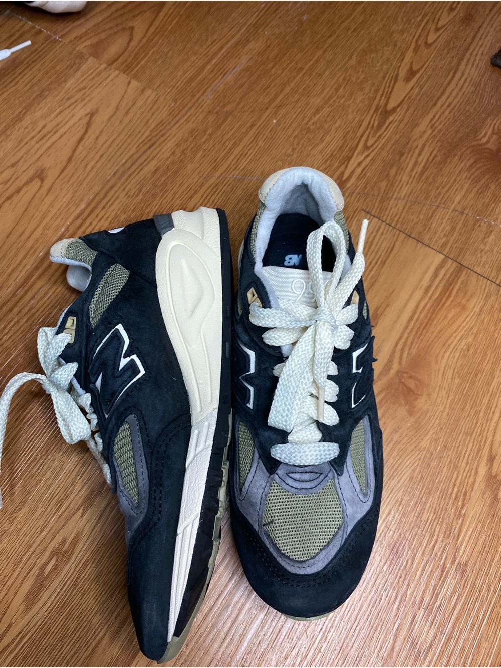 New Balance black, olive and cream suede mesh sneakers